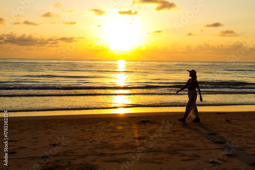 Woman relax with sunrise and silhouette