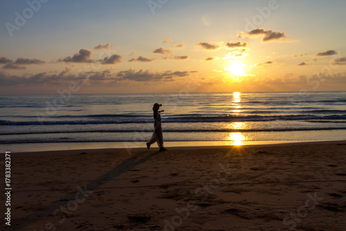 Woman relax with sunrise and silhouette