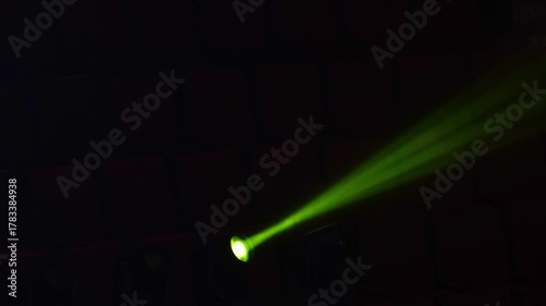Video of flashing green strobe lights in a concert. The vibrant, pulsating light creates an energetic and dynamic atmosphere, perfect for music events, parties, and stage performances