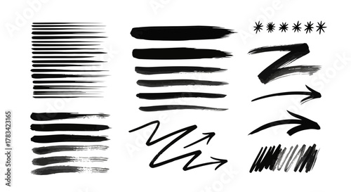 Collection of black brush stroke elements including lines arrows zigzags and stars on a white background
