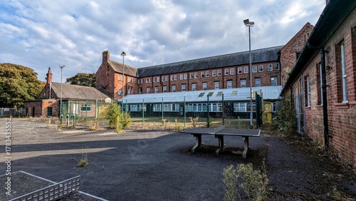 Abandoned Clarence House High School Formby, Liverpool. Derelict college buildings, astroturf play area, table tennis, empty tarmac playground. Desolate, deserted failing education system schoolyard