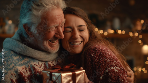 Tender Moment: A heartfelt scene unfolds as an elder person and a young adult share a tender moment, embracing warmly over a wrapped gift. capturing the bonds of familial love and holiday giving.