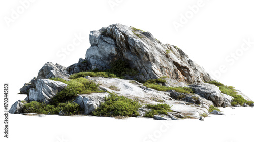 Rocky outcrop with green vegetation and sand