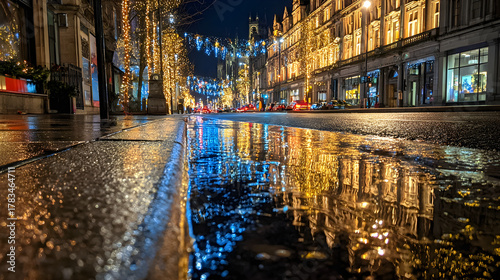 Fototapeta Naklejka Na Ścianę i Meble -  City street reflecting festive lights on wet pavement, cinematic night exposure and urban warmth