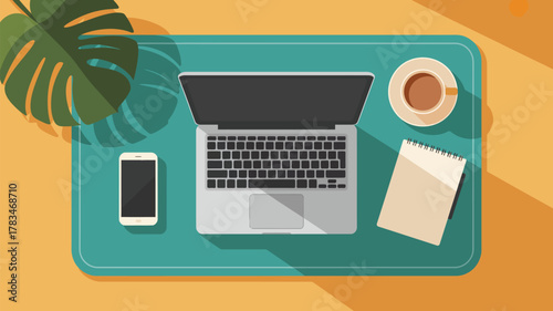 Top down view of a laptop, phone, notepad, and coffee cup on a blue tray with a monstera leaf decor