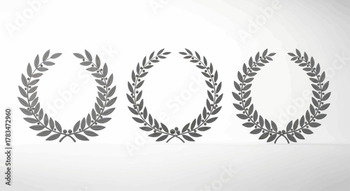 Three symmetrical laurel wreaths, each with detailed leaves and a central empty space, on a white background.