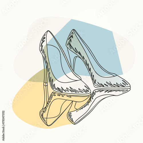 A pair of elegant high heels on a reflective marble floor under spotlight.