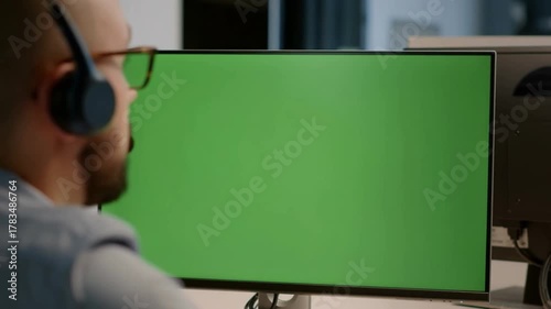 A person working on computer with green screen Stock Video