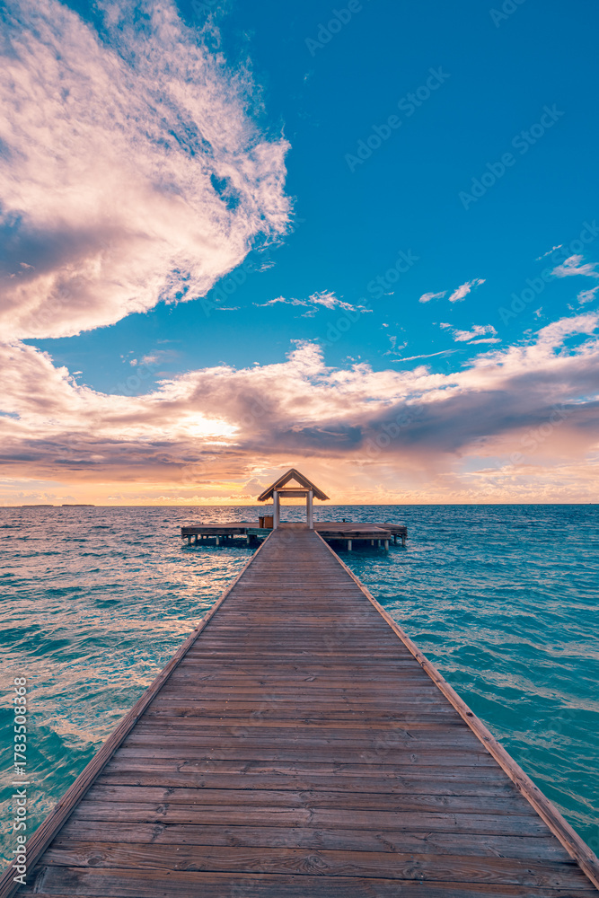 Fototapeta premium Dramatic wooden pier silhouette seascape horizon moody sunset sky. Golden sunlight reflection calm water surface. Inspirational wooden path tropical travel adventure destination background. Meditation