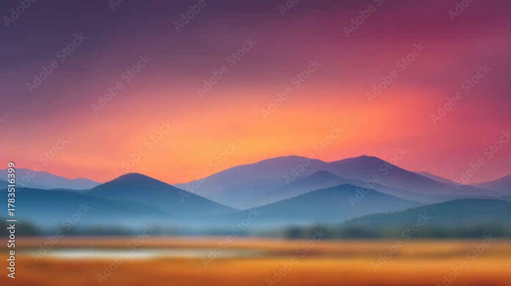 Fototapeta premium Serene landscape with soft mountains under a vibrant twilight sky showcasing colors of pink, orange, and purple reflecting on a tranquil atmosphere
