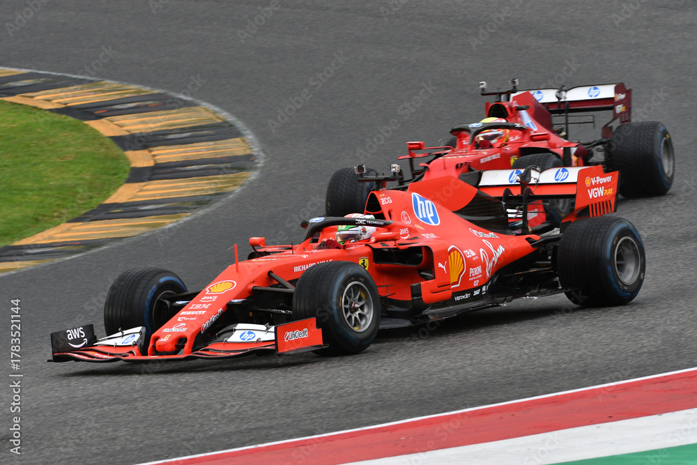 Fototapeta premium Scarperia; Italy - October 24th 2025: Ferrari SF90 ex Sebastian Vettel and Charles Leclerc in action during Ferrari World Finals 2025 at Mugello Circuit in Italy.