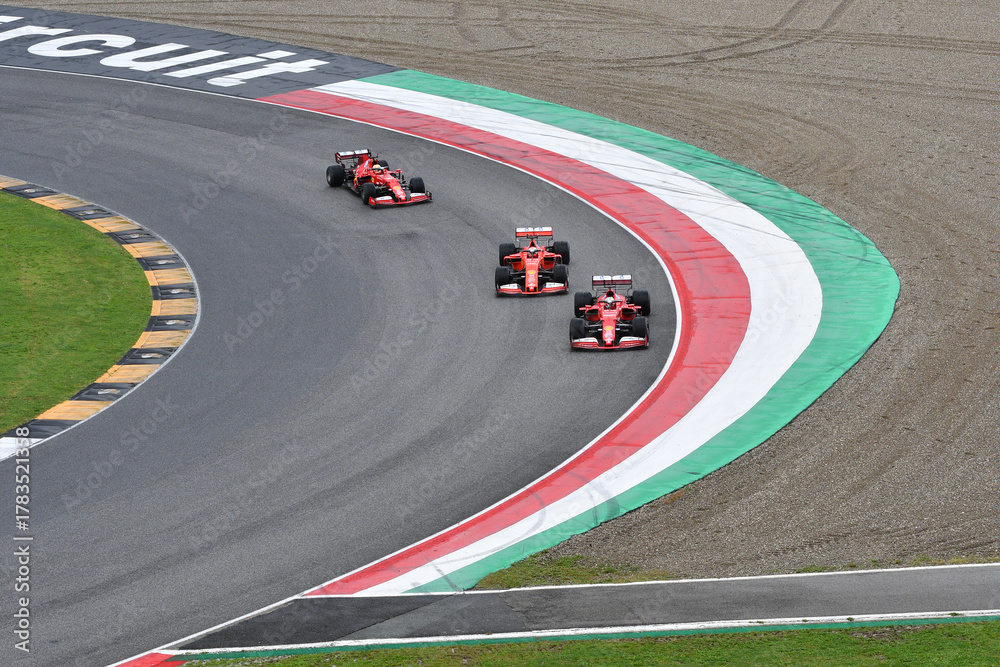 Obraz premium Scarperia; Italy - October 24th 2025: Ferrari SF90 and SF1000 ex Sebastian Vettel and Charles Leclerc in action during Ferrari World Finals 2025 at Mugello Circuit in Italy.
