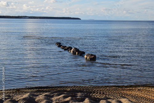 Fototapeta Naklejka Na Ścianę i Meble -  Stone breakwater on the Baltic Sea shore in  Baltic sea.