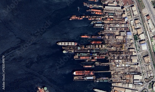 Quadro em tela Aerial satellite view showing cargo ships navigating across the blue ocean — hig