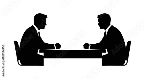 Two silhouetted men in suits sit opposite each other at a table