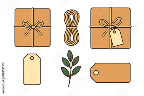 Assortment of packaging elements including wrapped gift boxes, blank tags, twine, and foliage