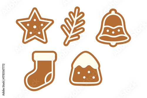 Festive gingerbread cookies decorated with white icing in star bell stocking and pine branch shapes