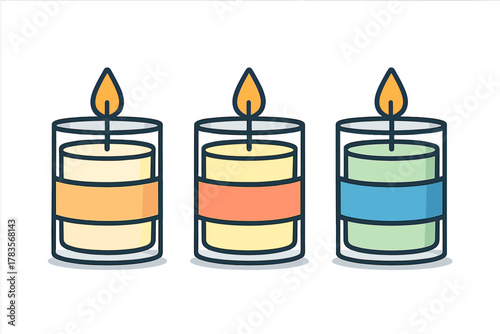 Colorful burning scented candles in glass jars for aromatherapy and relaxation