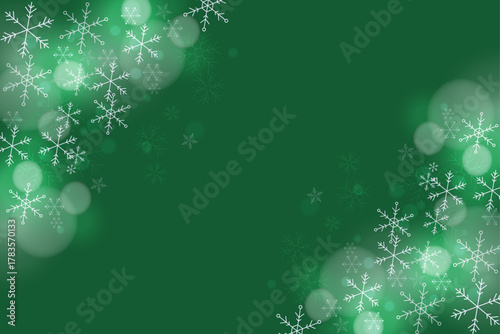 Winter Green Background with Sparkling Snowflakes and Bokeh Lights