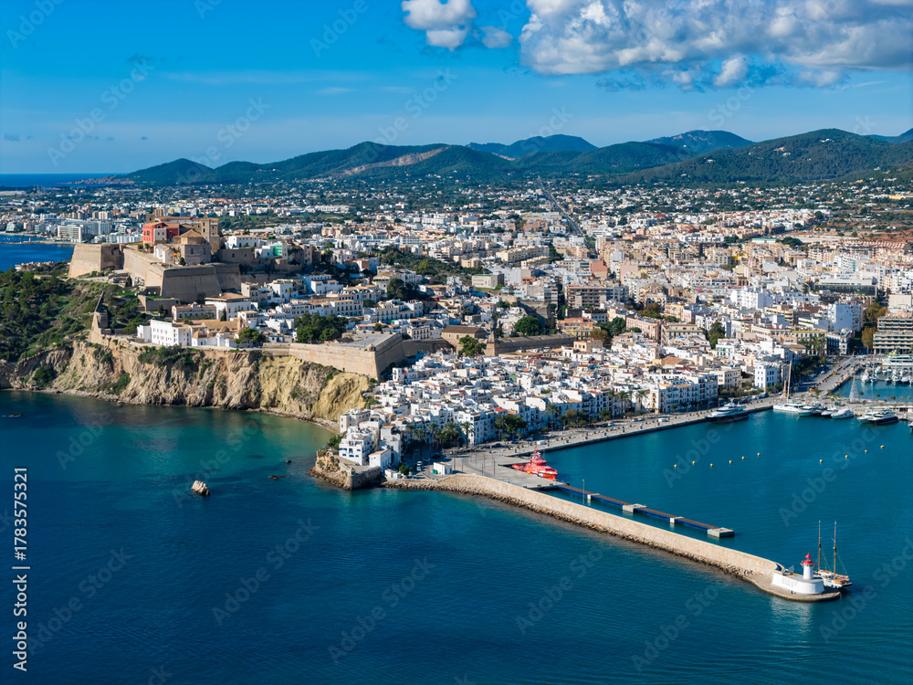 Fototapeta premium Aerial View of Dalt Vila (Eivissa Old Town) and the Busy Boat and Ferry Marina in Ibiza, Balearic Islands