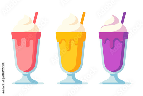 Row of three vibrant dessert milkshakes topped with sweet whipped cream and drinking straws