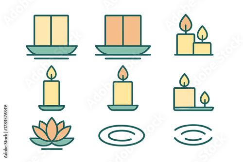 Burning and unlit candles with a lotus flower on a dish for spa and relaxation themes