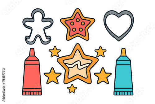 Assortment of baking tools and decorated holiday cookies with metal cutters and colorful frosting tubes