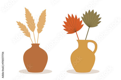 Boho style vases with dried pampas grass and palm leaves arrangement