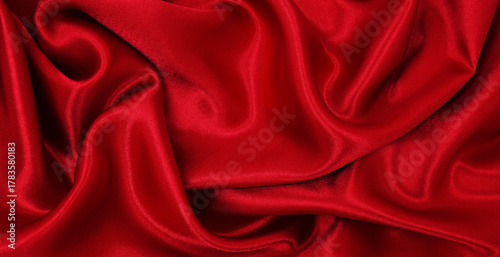 Smooth elegant red silk or satin luxury cloth texture as abstract background. Luxurious valentines day background design