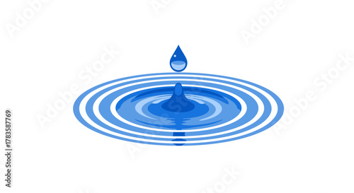 Blue water droplet falling onto a surface causing concentric ripples