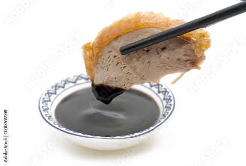 Traditional Peking Duck Slices with Cucumber, Scallion, and Sweet Bean Sauce on White Isolated Background – Chinese Cuisine