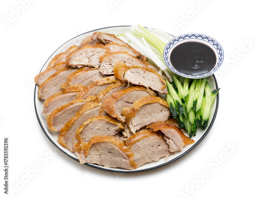 Traditional Peking Duck Slices with Cucumber, Scallion, and Sweet Bean Sauce on White Isolated Background – Chinese Cuisine