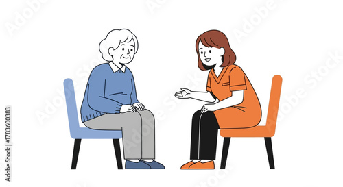 An elderly woman sits and talks with a younger woman, likely a caregiver, in a supportive conversation.