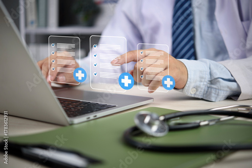 Doctor hands using laptop accessing electronic medical record system digital health checklist document online patient data management healthcare technology workflow hospital compliance.