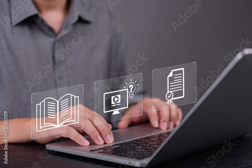 Man hand using laptop for e-learning, online education. Virtual interface icon workflow: knowledge book, webinar course, get certificate. Skill development, employee training, qualification concept.