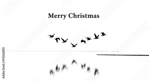Minimalist merry christmas greeting card featuring a flock of birds flying in formation above a calm reflective water surface