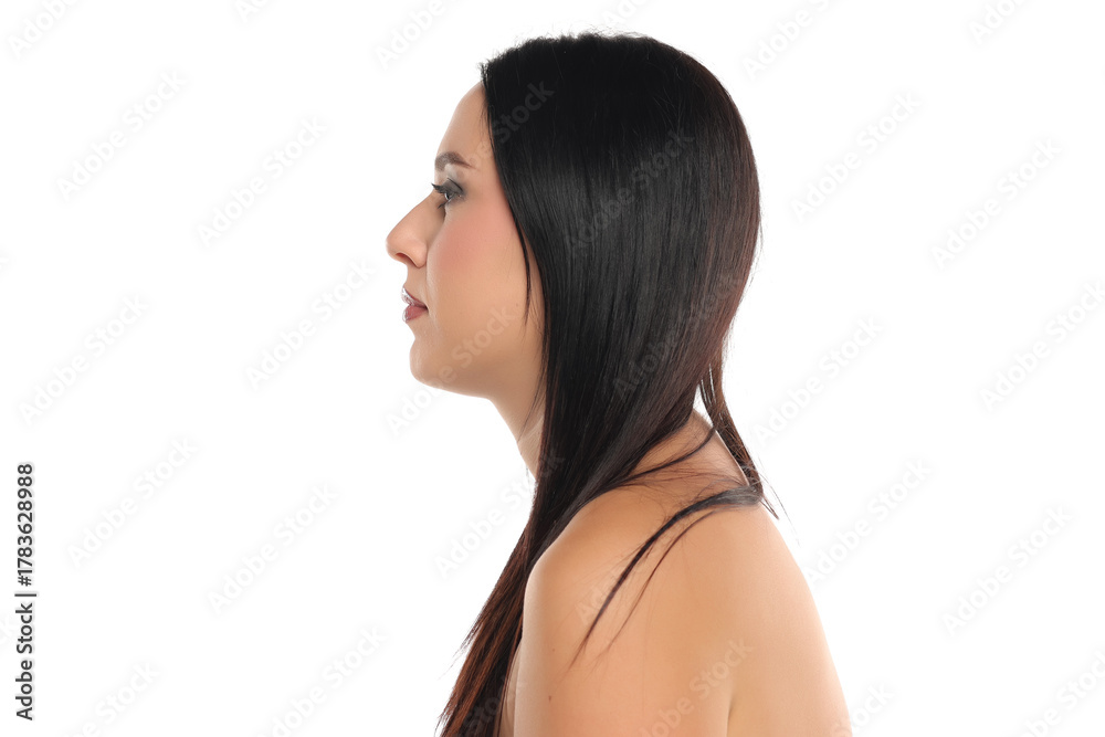 Fototapeta premium Studio shot of a woman with dark straight hair in profile view on a white background.