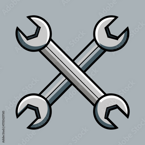 Two silver wrenches crossed against gray backdrop on transparent background
