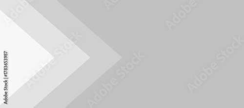 Gray background with white and light gray arrow shapes creating modern abstract design