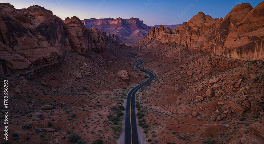 Fototapeta premium Drone Photography of Canyon Road Through American Southwest Red Rocks Landscape