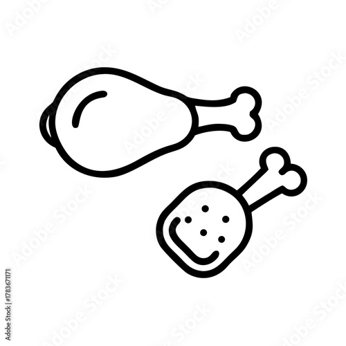 A black and white image of a cat with green eyes