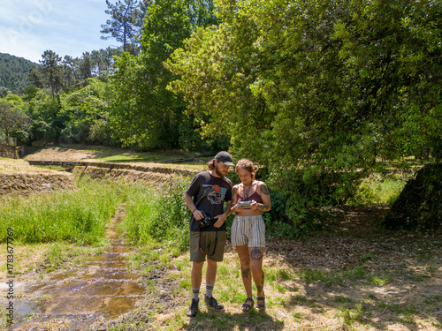Couple Using Drone and Camera for Travel Photography near Lucca, Tuscany, Italy