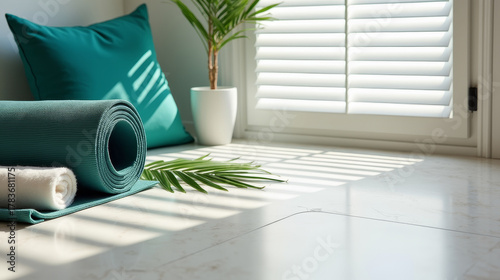 Modern wellness flat lay with yoga mat, towel, and palm leaf on white surface, natural daylight and calm mood