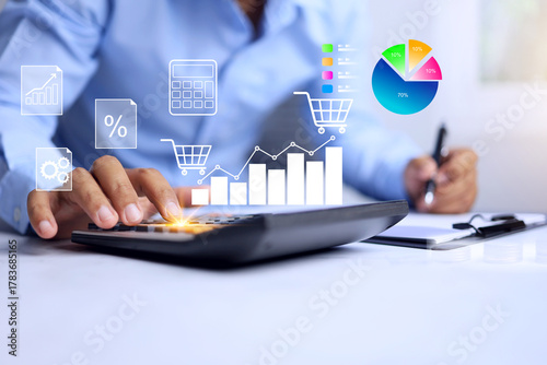 market share concept with businessman using calculator to calculate the customer or buyer to analysis on pie chart for market share to plan sale strategy and marketing