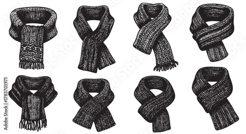 Eight intricately patterned black and white scarves are shown, each arranged in a different style and knot, showcasing detailed knit textures.
