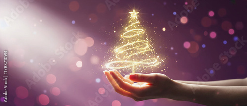 Enchanting Yuletide: A person cradles a radiant, golden Christmas tree, with light dancing amidst a magical bokeh backdrop. This image embodies the wonder and hope associated with the holiday season.