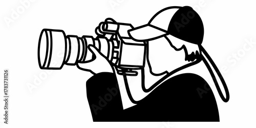 Silhouette of a photographer with a camera wearing a cap and holding the equipment firmly in hands