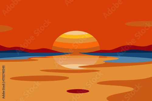 Vibrant sunset over calm water and sandy shoreline