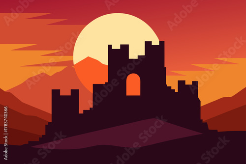 Silhouette of a medieval castle against a vibrant sunset sky and mountains