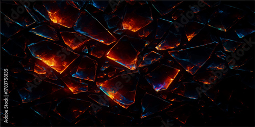 Close-up texture of a hot flame and glowing embers from a burning wood fire in a fireplace, showing red and orange light on black coal